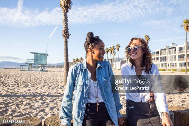 los angelinos on the venice beach boulevard and beach having fun in a sunny day in california - venice beach stock pictures, royalty-free photos & images
