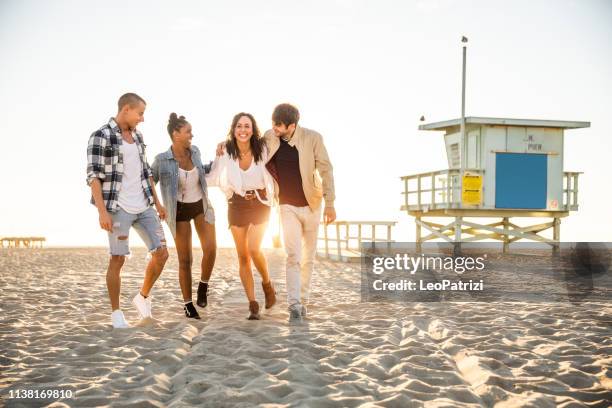 los angelinos on the venice beach boulevard and beach having fun in a sunny day in california - beach la stock pictures, royalty-free photos & images