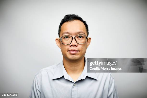 mid adult professional wearing eyeglasses - chinese nerd stock pictures, royalty-free photos & images