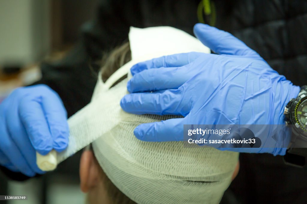 First aid training, head bandage