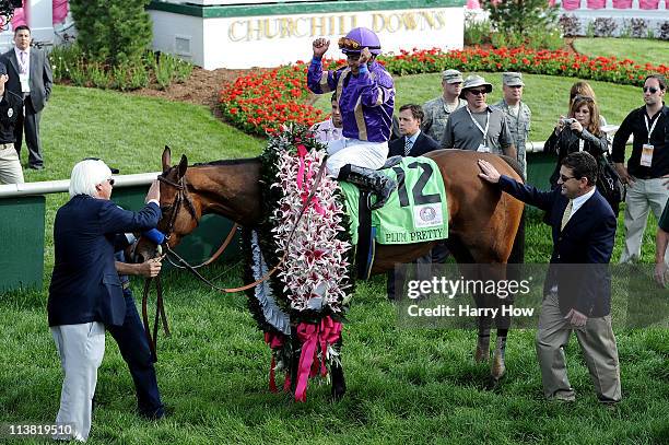 Jockey Martin Garcia, riding Plum Pretty celebrate their win in the 137th Kentucky Oaks at Churchill Downs on May 6, 2011 in Louisville, Kentucky.