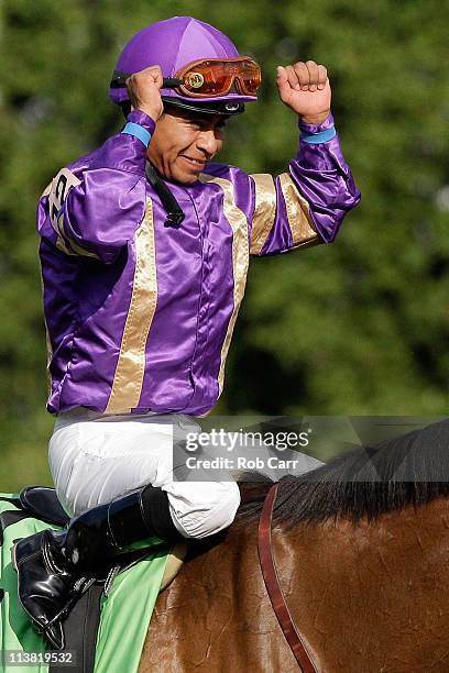 Jockey Martin Garcia, riding Plum Pretty, celebrates in the winners circle after they won the 137th Kentucky Oaks at Churchill Downs on May 6, 2011...