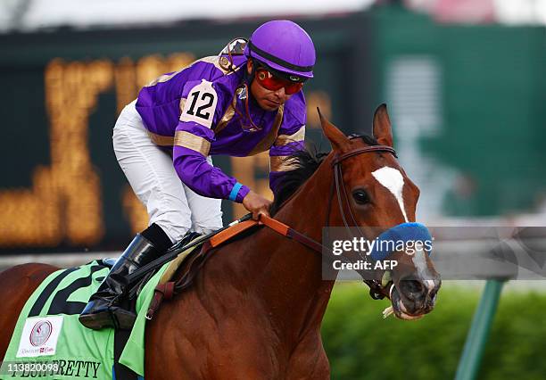 Jockey Martin Garcia is seen atop fillie Plum Pretty after crossing the finish line in first place during the 137th running of the Kentucky Oaks on...