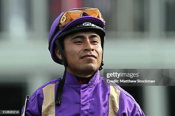 Jockey Martin Garcia, riding Plum Pretty, celebrates in the winners circle after they won the 137th Kentucky Oaks at Churchill Downs on May 6, 2011...