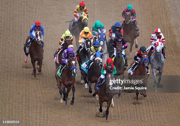 Jockey Martin Garcia , riding Plum Pretty and Jockey Gabriel Saez , riding Summer Soiree, lead the field down the front stretch at the start of the...