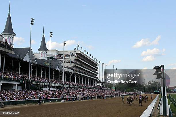 Jockey Martin Garcia , riding Plum Pretty heads towards the finish line to edge out jockey Rosie Napravnik, riding St. John's River for the win...