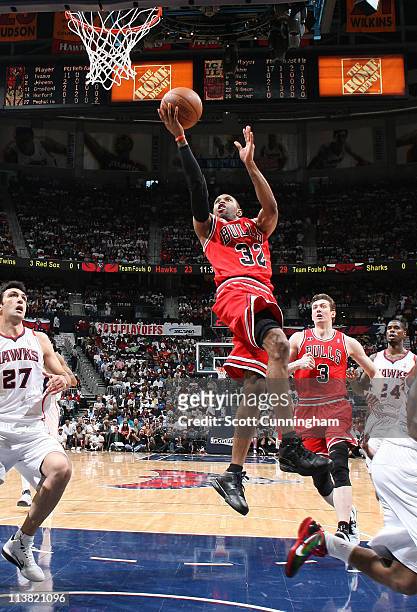 Watson of the Chicago Bulls shoots against Zaza Pachulia of the Atlanta Hawks in Game Three of the Eastern Conference Semifinals in the 2011 NBA...