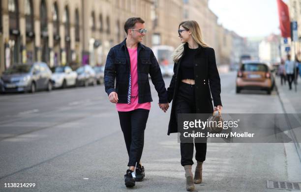 Ann-Kathrin Goetze wearing Boss coat, Dior glasses, Louis Vuitton bag, Iro pants, Zara Crop Sweater, gianvito Rossi heels and Mario Goetze wearing...