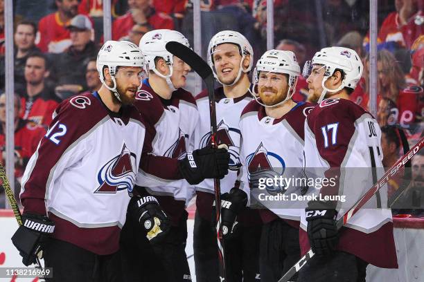 Colin Wilson of the Colorado Avalanche celebrates with his teammates after scoring against the Calgary Flames in Game Five of the Western Conference...