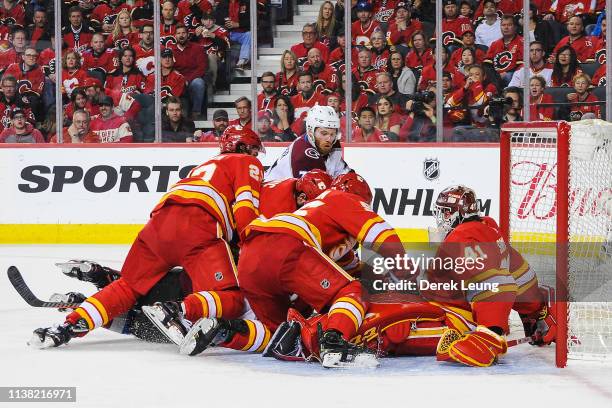 Compher of the Colorado Avalanche takes a shot on Mike Smith of the Calgary Flames in Game Five of the Western Conference First Round during the 2019...