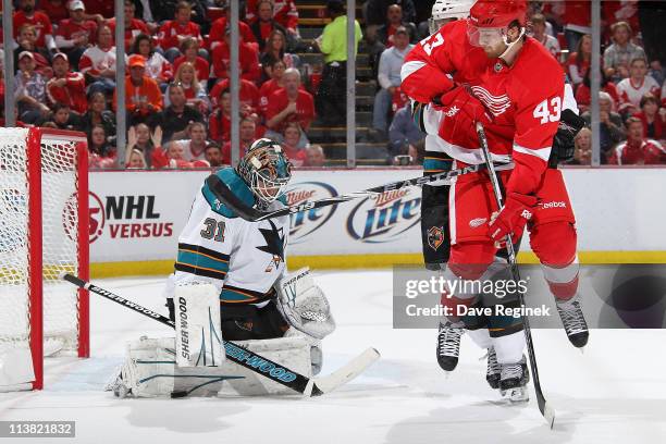 Antti Niemi of the San Jos Sharks makes a save on Darren Helm of the Detroit Red Wings in Game Four of the Western Conference Semifinals in the 2011...