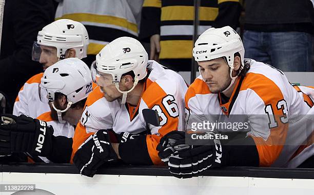 Darroll Powe and Daniel Carcillo of the Philadelphia Flyers react late in the third period against the Boston Bruins in Game Four of the Eastern...