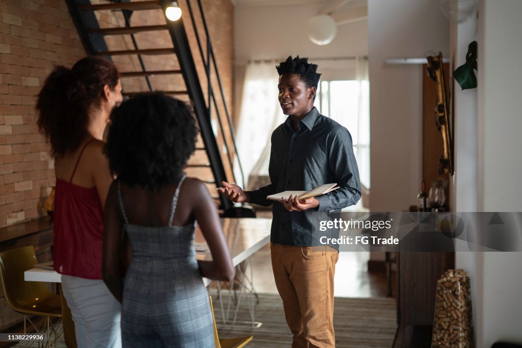 Real estate agent showing a property to consumers