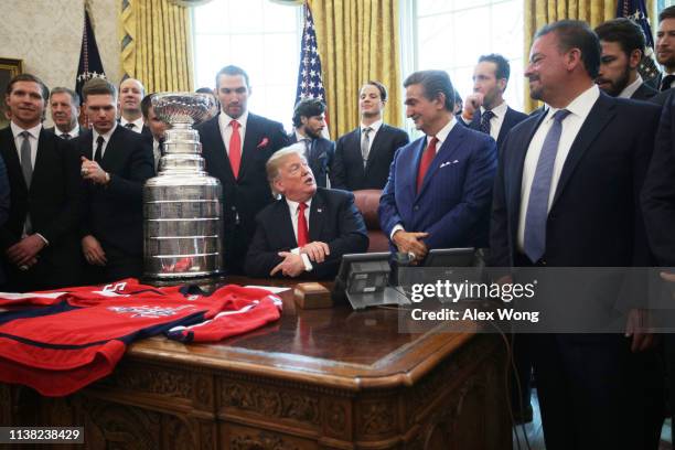 President Donald Trump speaks as team owner of the Washington Capitals Ted Leonsis and team members, including left wing and MVP Alexander Ovechkin,...