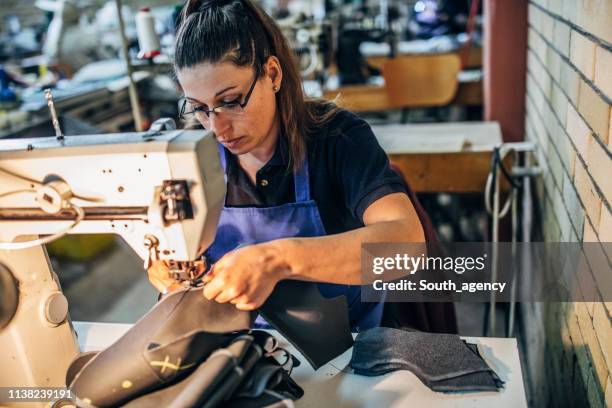 woman sewing shoes - needle plant part stock pictures, royalty-free photos & images