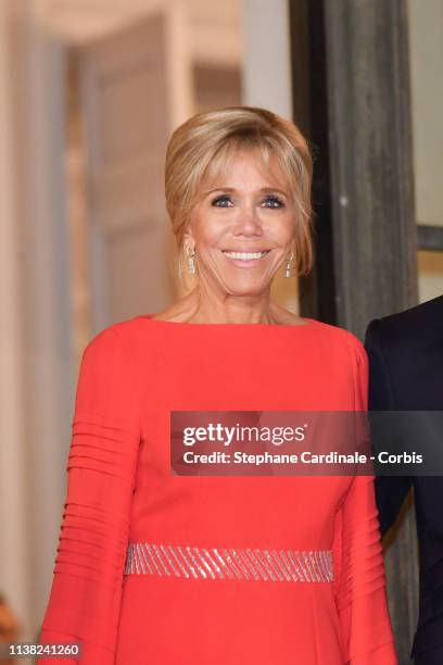 Brigitte Macron pose prior to a state dinner with Chinese President Xi Jinping at the Elysee Presidential Palace on March 25, 2019 in Paris, France....