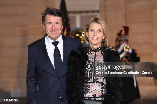 Mayor of Nice Christian Estrosi and his wife Laura Tenoudji arrive for a state dinner at the Elysee Presidential Palace on March 25, 2019 in Paris,...