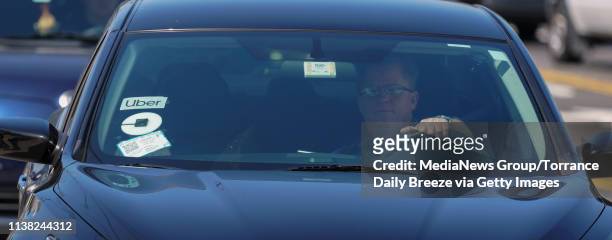 An Uber drivers arrives for a one-day strike against Uber and Lyft at an Uber office on Marine Avenue in Redondo Beach on Monday, Mar 25, 2019. Over...