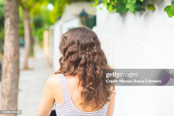 long haired woman - back of womens heads stockfoto's en -beelden