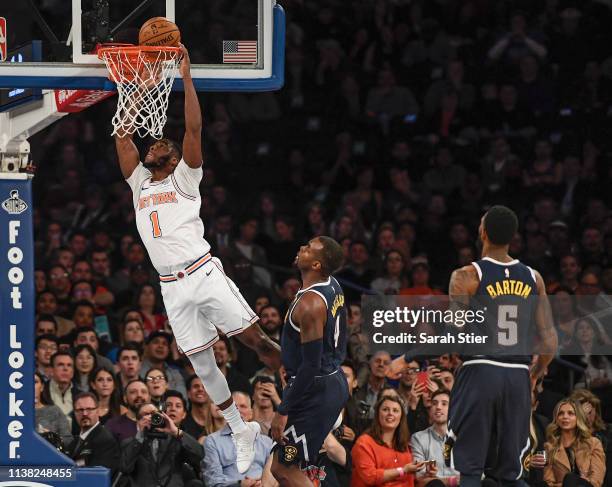 Emmanuel Mudiay of the New York Knicks attempts a slam dunk during the first half of the game against the Denver Nuggets at Madison Square Garden on...