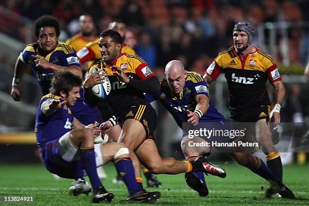 Lelia Masaga of the Chiefs makes a break during the round 12 Super Rugby match between the Chiefs and the Highlanders at Waikato Stadium on May 7,...