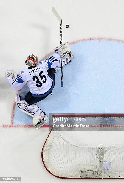 Teemu Lassila, goaltender of Finland makes a save during the IIHF World Championship qualification match between Germany and Finland at Orange Arena...