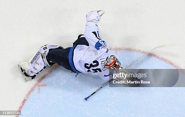 Teemu Lassila, goaltender of Finland makes a save during the IIHF World Championship qualification match between Germany and Finland at Orange Arena...