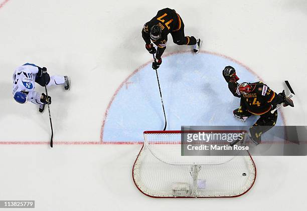 Jarkko Immonen of Finland scores over Dennis Endras , goaltender of Germany during the IIHF World Championship qualification match between Germany...