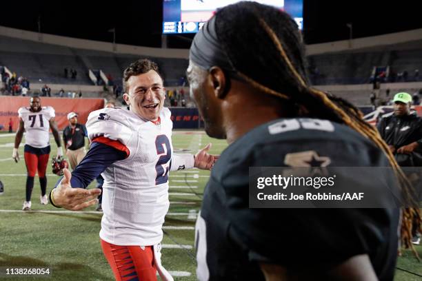 Johnny Manziel of the Memphis Express talks with Trent Richardson of the Birmingham Iron after the game at Liberty Bowl Memorial Stadium on March 24,...