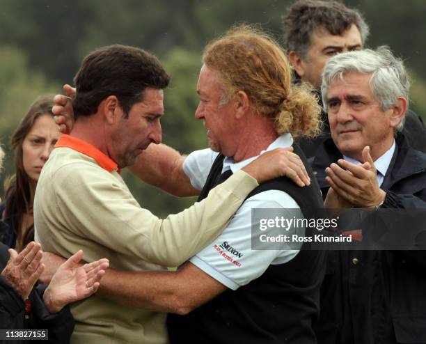 Jose Maria Olazabal of Spain and Miguel Angel Jimenez of Spain after the minute silence held in memory of Seve Ballesteros during the third round of...