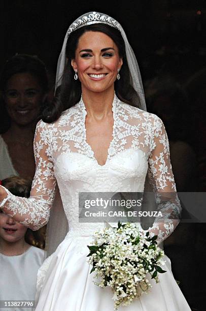 Kate, Duchess of Cambridge, comes out of Westminster Abbey, with her husband Britain's Prince William following their wedding ceremony, in central...