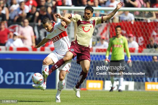 Zdravko Kuzmanovic of Stuttgart fights for the ball with Mohammed Abdellaoue of Hannover during the Bundesliga match between VfB Stuttgart and...