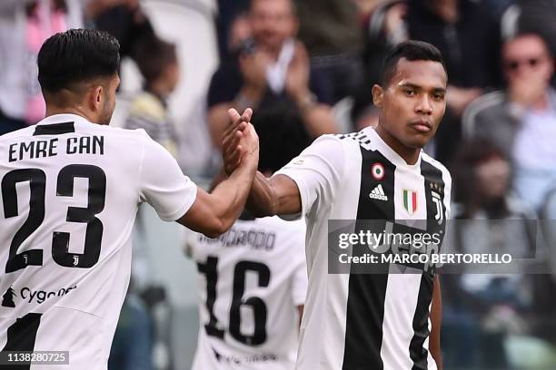 Juventus' Brazilian defender Alex Sandro celebrates with Juventus' German midfielder Emre Can after scoring an equalizer during the Italian Serie A...