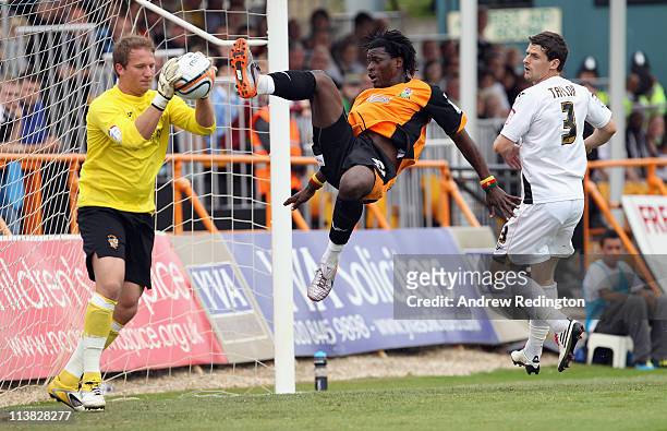 Clovis Kamdjo of Barnet challenges Port Vale's goalkeeper Chris Martin during the npower League Two match between Barnet and Port Vale at Underhill...