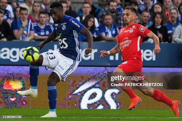 Strasbourg's French defender Lionel Carole vies with Montpellier's French defender Ruben Aguilar during the French L1 football match between...