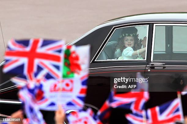 Young bridemaid Grace van Cutsem, three, the daughter of Prince Williamâs friend Hugh van Cutsem, is driven past Buckingham Palace prior the royal...