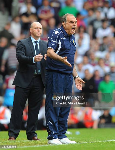 West Ham United manager Avram Grant shouts orders to his team during the Barclays Premier League match between West Ham United and Blackburn Rovers...