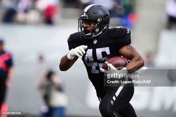 Brandon Ross of the Birmingham Iron runs the ball against the Orlando Apollos during their Alliance of American Football game at Legion Field on...