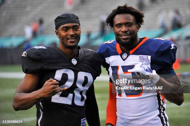 Bryce Canady of the Birmingham Iron and DeVozea Felton of the Orlando Apollos pose during their Alliance of American Football game at Legion Field on...