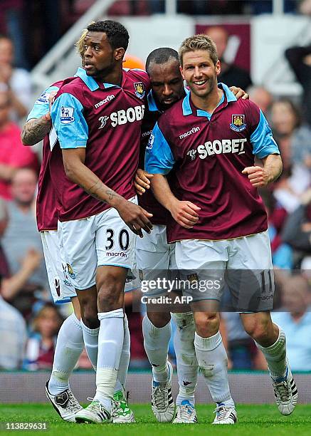 West Ham's German midfielder Thomas Hitzlsperger celebrates scoring his goal with team-mates during the English Premier League football match between...