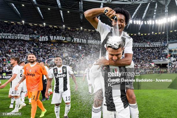 Cristiano Ronaldo and Juan Cuadrado of Juventus celebrate the winning of the Italian championship 2018-2019 after the Serie A match between Juventus...