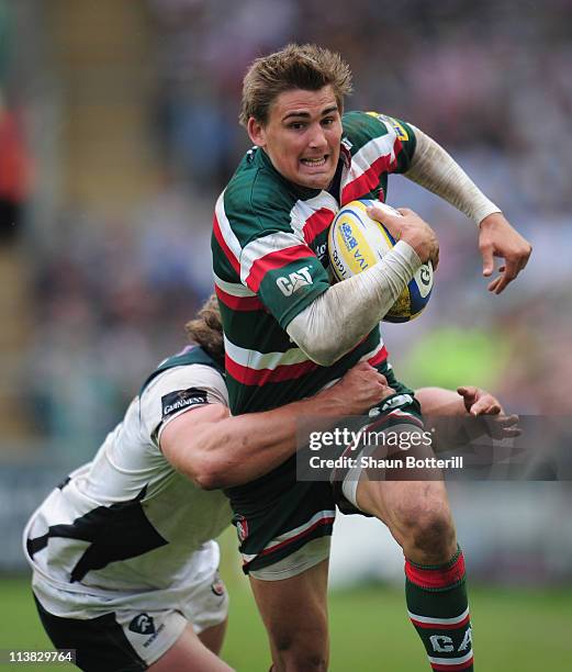 Toby Flood of Leicester Tigers is tackled by Max Lahiff of London Irish during the AVIVA Premiership match between Leicester Tigers and London Irish...