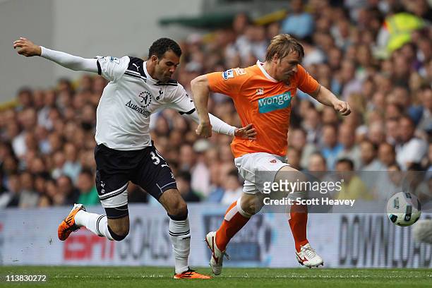 Raniere Sandro of Spurs fights for the ball with Sergey Kornilenko of Blackpool during the Barclays Premier League match between Tottenham Hotspur...