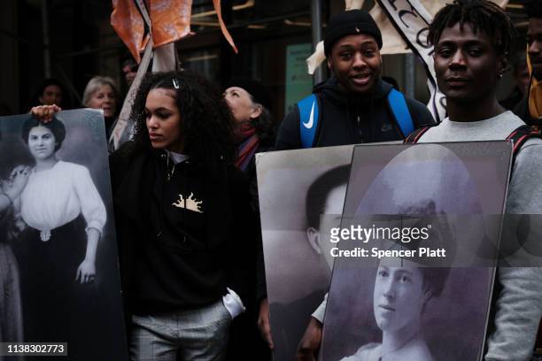 Holding flowers, pictures and traditional dresses, people attend the 108th anniversary ceremony for the victims of the Triangle Shirtwaist Factory...