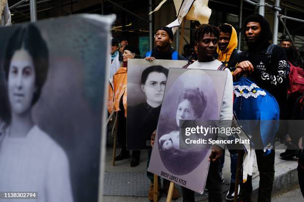 Holding flowers, pictures and traditional dresses, people attend the 108th anniversary ceremony for the victims of the Triangle Shirtwaist Factory...