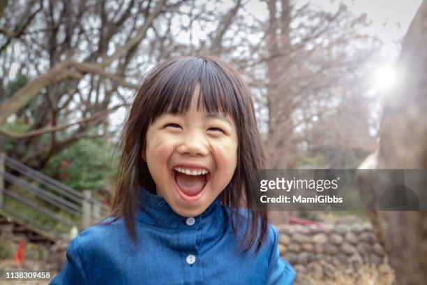 little girl playing on park - girls misbehaving stock pictures, royalty-free photos & images