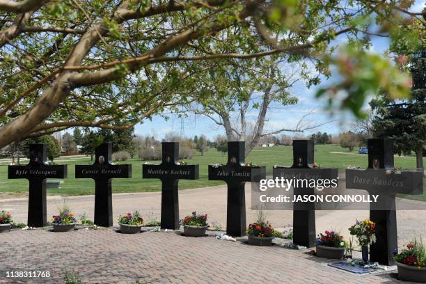Crosses with the names and portraits of the victims of the 1999 Columbine High School massacre are seen at the Chapel Hill Memorial Gardens in...