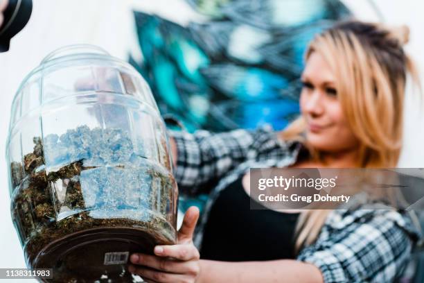 Budtender CJ Raye prepares Marijuana samples at the Welcome to Cannacity - 'She's Smokin' Event on April 20, 2019 in Los Angeles, California.