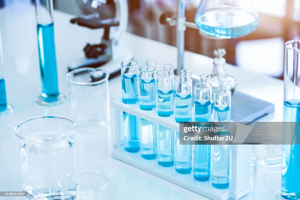 Laboratory test tubes and solution with stethoscope background. Science and Medical concept. Scientist research and analysis biotechnology concept