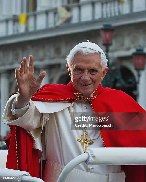 Pope Benedict XVI greets well-wishers gathered in St Mark's Square in an electric vehicle on May 7, 2011 in Venice, Italy. Pope Benedict XVI is...